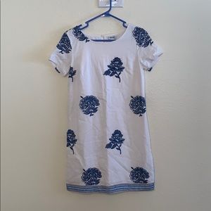 White dress with floral designs